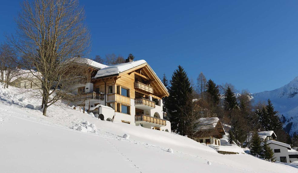 A luxury chalet set in a winter wonderland