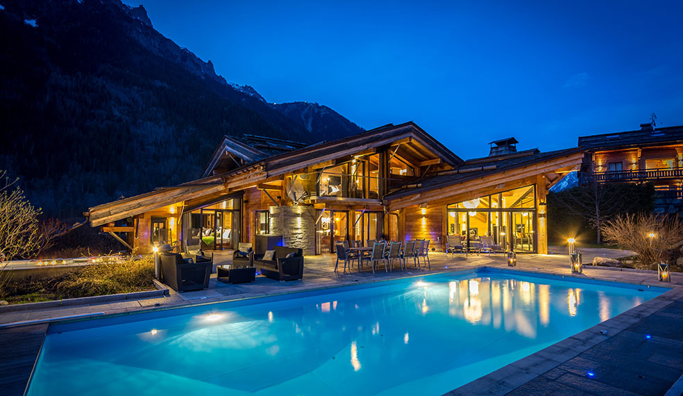 Luxury Chalet Couttet evening ambience around the stunning outdoor pool